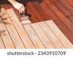 Exterior wood deck renovation, annual refreshing, worker
