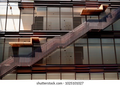 Exterior Wooden Staircase On The Side Of An Office Building In Downtown Singapore

