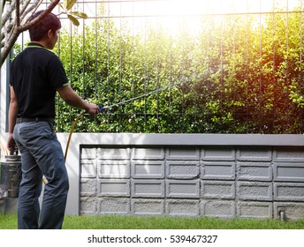 The Exterminator,Technicians Compressed Chemicals Into The Soil Around The Area. To Break The Cycle Termite Queens. Selective Focus.
