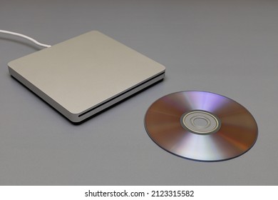 External Drive Next To Which Lies A Laser Disc. High Quality Photo