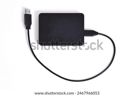 External Hard Disk drive with usb cable isolated on white background. External HDD with usb connector