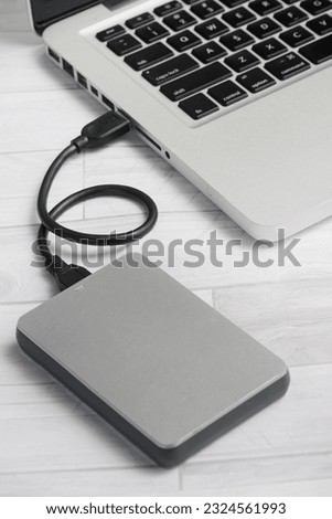 External hard drive connect with laptop with USB cable                              
