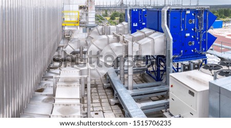 External infrastructure of the microclimate support system at a large industrial site. Air pipelines inlet and exhaust. Fans and air conditioning. Systems of control of pressure, humidity, temperature