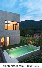 External Of A Modern House With Pool, Night Scene