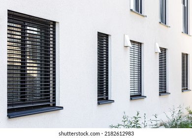 External Roller Blinds on Modern Windows Outside. External Shutters on Windows of House.