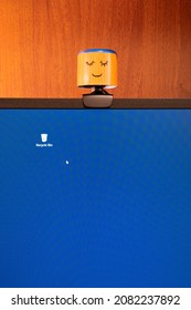 External Round Black Web Camera With A Smiling Cap On A Black Monitor. Smiling Cover For A Webcam. Protection Against Spying.