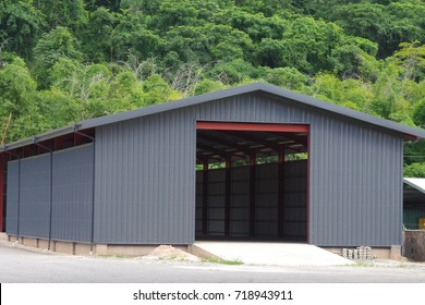 External View Of A Brand New And Modern Warehouse In The Middle Of The Jungle.