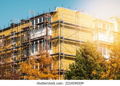 External Wall Insulation During Autumn Season. Solid Wall Insulation. Energy Efficiency House Wall Renovation For Energy Saving.