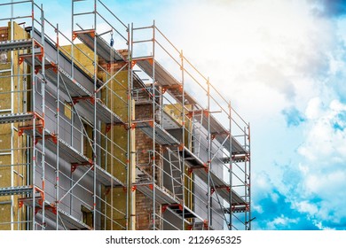 External wall insulation. Energy efficiency house wall renovation for energy saving. Exterior house wall heat insulation with mineral wool, building under construction.