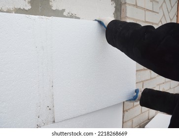 External Wall Insulation: Thermal exterior wall insulation with rigid foam board. Insulating your home saves you money on lower heating bills - Shutterstock ID 2218268669