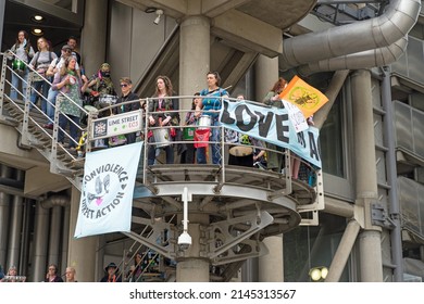 Extinction Rebellion protest on the steps of the Lloyds building in the City of London to raise awareness of climate change. London - 12th April 2022