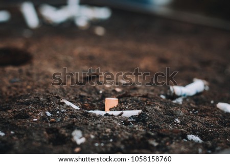 Extinguished Cigarette on a ground