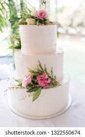 Three Tiers Buttercream Wedding Cake With Fresh Flowers Images