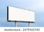 extra large Outdoor billboard with white background mock up. on clouds and blue sky background. Copy space for advertisement.