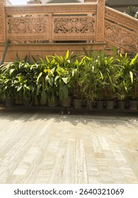 An extra ordinary white marble parking tiles view bear by a stone carving wall design.