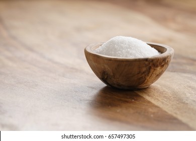 Extra Sea Salt In Wood Bowl On Wooden Table, With Copy Space