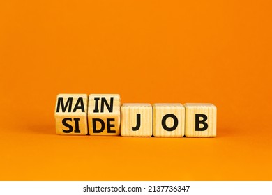 Extra or side job symbol. Turned wooden cubes and changed concept words Side job to Main job. Beautiful orange table orange background, copy space. Business side or main job concept. - Shutterstock ID 2137736347