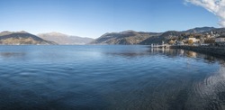 Extra Wide Angle View Of The Promenade On The Lake In Luino With The Mountains In The Background