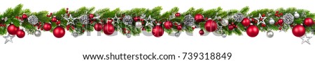 Extra wide Christmas border with hanging garland of fir branches, red and silver baubles, pine cones and other ornaments, isolated on white