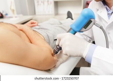 Extracorporeal Shockwave Therapy ESWT.Effective non-surgical treatment.Physical therapy for tennis elbow with shock waves.Pain relief, normalization and regeneration,stimulation of healing process. - Powered by Shutterstock