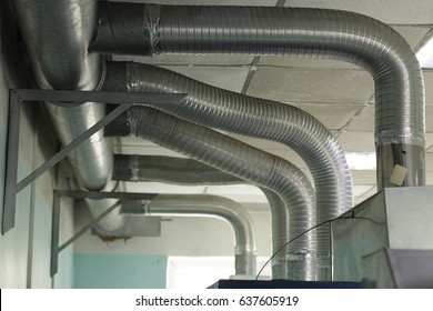 Extraction of harmful gases from the room through the ventilation pipes. Home air extraction system. Ventilation system. The concept of industrial equipment and technologies. HVAC industry.