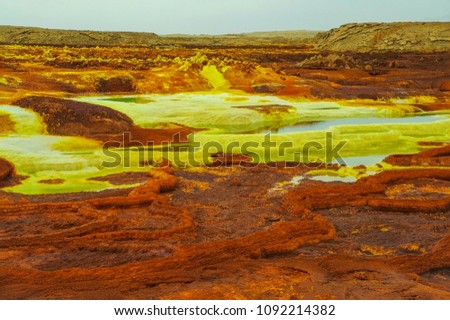 Extraterrestrial landscape. Landscape of green acid ponds and salt terraces. Iron oxide, sulfur and salt desert plains. Volcanic crater Dallol. Hottest place on Earth. Ethiopia, Danakil Depression
