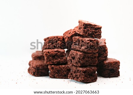 Extream close up shot of stack homemade chocolate brownies cracker, Pieces of fresh brownie on white background. Delicious chocolate pie.