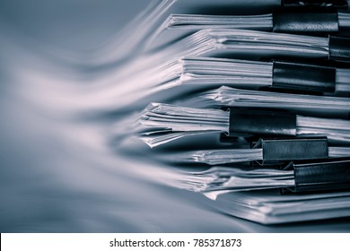 extreamely close up  report paper stacking of office working document , retro color tone