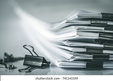 extreamly close up  stacking of office working document with paper clip folder, vintage color tone