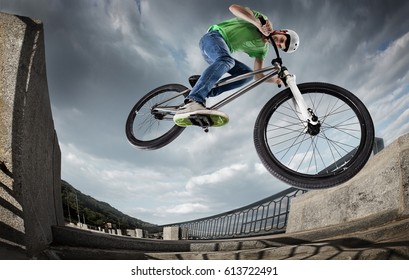 Extrem Sport. Boy jumping with his street-bike in the city. - Powered by Shutterstock