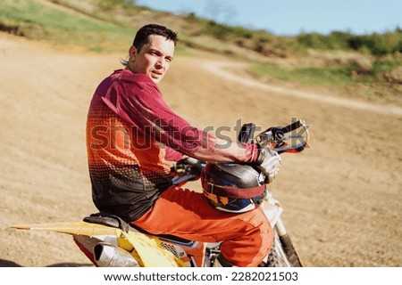 Extreme and Adrenaline. Motocross rider close up portrait. Motocross sport. Active lifestyle.