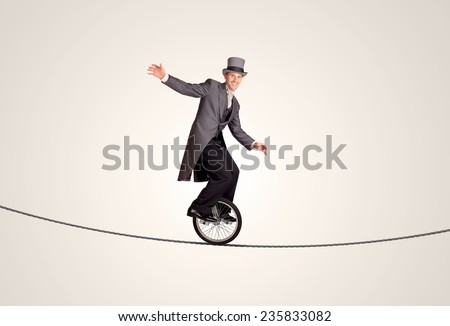Extreme business man riding unicycle on a rope concept on background