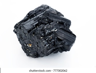 extreme close up of black tourmaline mineral isolated over white background