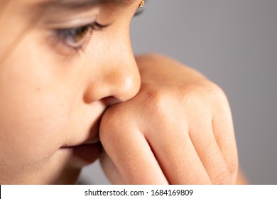 Extreme Close Up Of Child Touch's Her Nose - Concept Showing To Prevent And Avoid Touching Your Nose. Protect From COVID-19 Or Coronavirus Spreading Or Outbreak - Don T Touch Your Nose