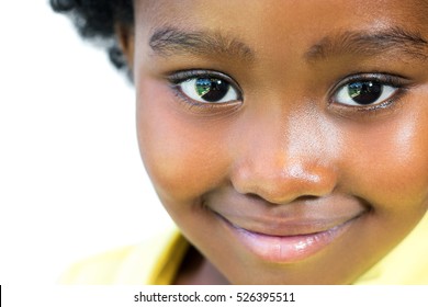 Extreme close up face shot of beautiful little african girl isolated on white background. - Powered by Shutterstock