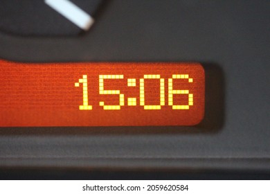 Extreme close up of an LCD clock in a vehicle gauge cluster