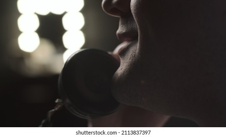 Extreme Close Up Look At Mouth Of Man Who Talks On Old Vintage Retro Phone. There Light In The Back, Counter. Beautiful Movie Look Of Chatter On Phone.