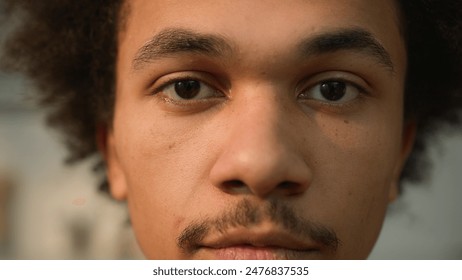 Extreme close up portrait African American ethnic guy male man looking down close eyes close gaze look at camera face healthy skincare medicine facial expression at home indoors client student calm - Powered by Shutterstock