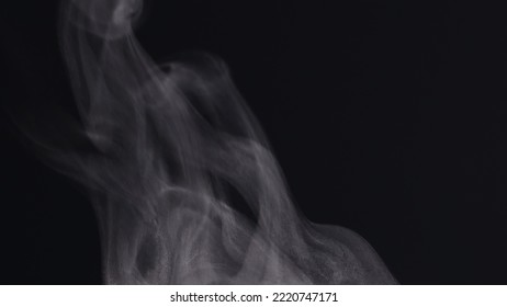 Extreme Close Up White Steam Smoke Vapor Rising Up From Hot Coffee Cup, Realistic Nature Steam Smoke, Mist On Black Background, 4K. Concept Of Steam, Smoke, Vapor, Mist, Fog