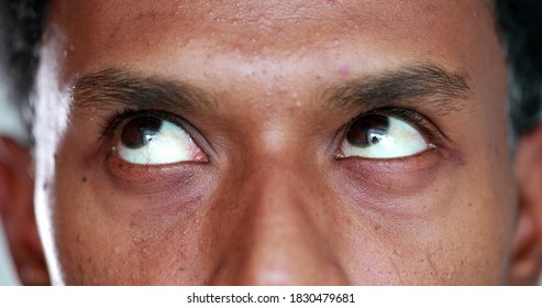 Extreme Close-up Of African American Man Eyes Looking Up , Down And Sideways