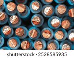 Extreme close-up of a cross-section of a bundle of copper wire electric cable