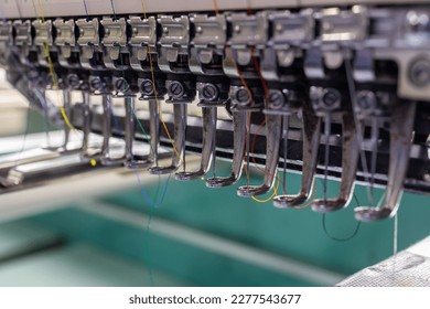 Extreme close-up of Embroidery machine needle in Textile Industry at Garment Manufacturers, Embroidery needle, Needle with thread