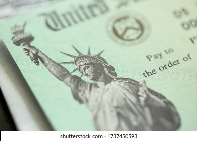 Extreme close-up of Federal coronavirus stimulus check provided to all Americans from the United States Treasury in 2020 and 2021, showing the statue of liberty.  - Shutterstock ID 1737450593