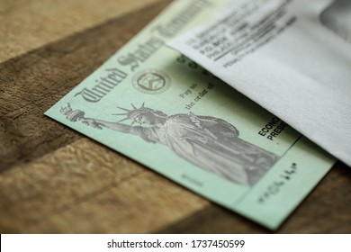 Extreme close-up of Federal coronavirus stimulus check provided to all Americans from the United States Treasury in 2020 and 2021, showing the statue of liberty.  - Shutterstock ID 1737450599