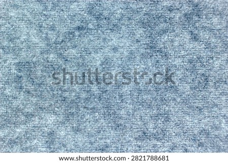 Extreme close-up macro view of light blue A4 paper surface with detailed fibrous texture. Perfect for graphic design backgrounds, print materials, stationery mockups and creative digital projects