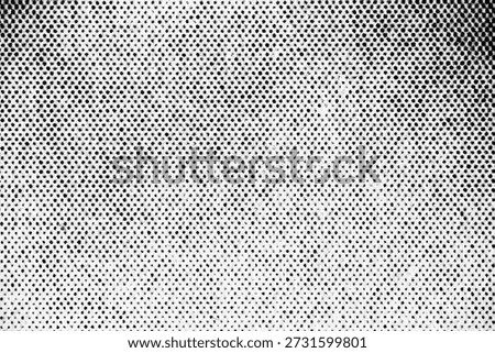 Extreme close-up of printed halftone pattern with evenly spaced black dots creating a soft gradient across a white surface.