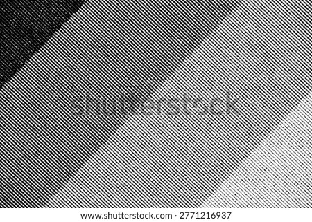 Extreme close-up of printed halftone pattern with sharp diagonal lines and bold contrast, showing fine ink texture on paper.
