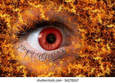 extreme close-up of red female eye on fire - Shutterstock ID 56278267
