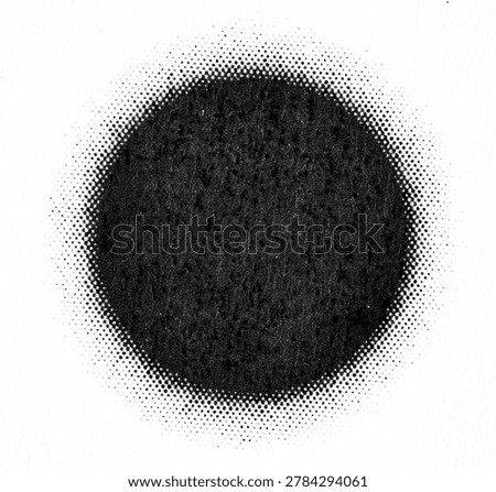 Extreme close-up of a solid black circle printed on paper, surrounded by a halftone dot gradient fading into white.