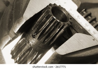 extreme close-up of wrench and small gear against shiny titanium - Shutterstock ID 2617771